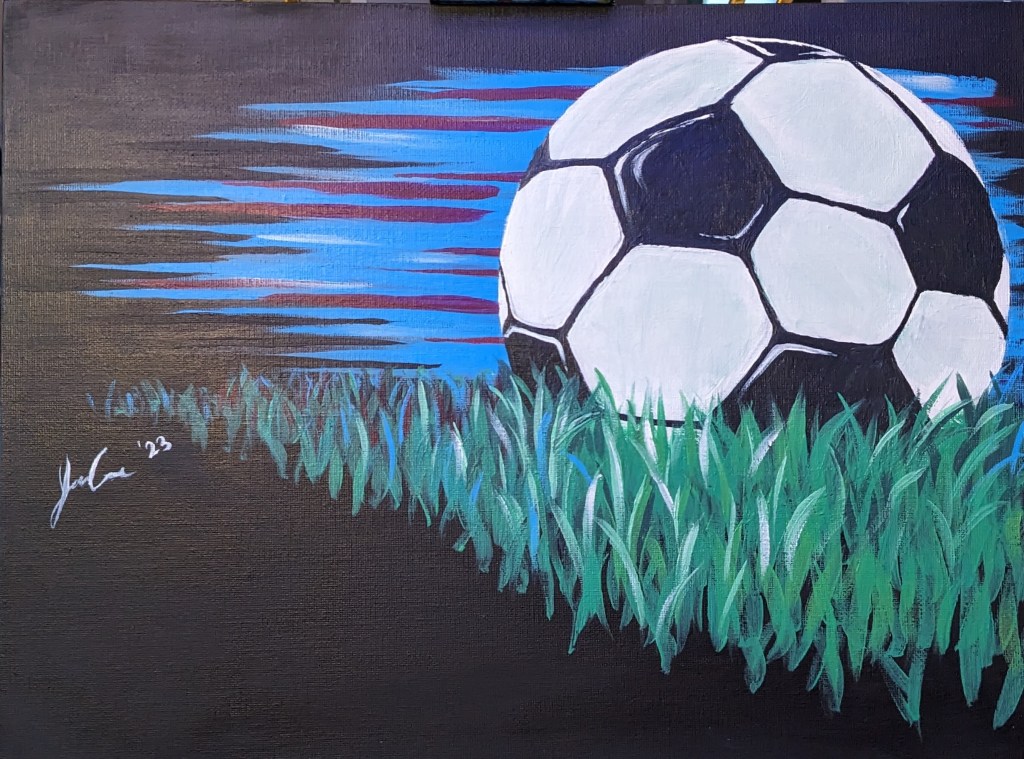 This is a 16"x12" acrylic painting of a soccer ball and grass, with a black background and abstract blue and red stripes behind the ball.